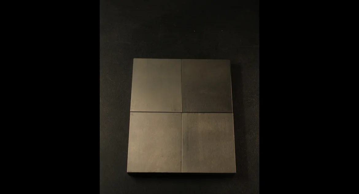 Four precision-ground tungsten bucking bar working faces viewed from above, showing the clean flat surface that prevents marks on the rivet skin