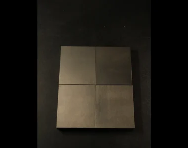 Four precision-ground tungsten bucking bar working faces viewed from above, showing the clean flat surface that prevents marks on the rivet skin